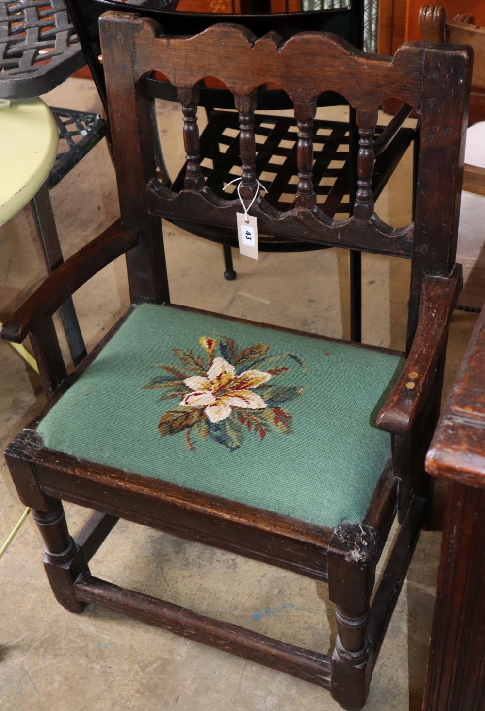 An 18th century and later oak elbow chair, W.58cm, H.75cm
